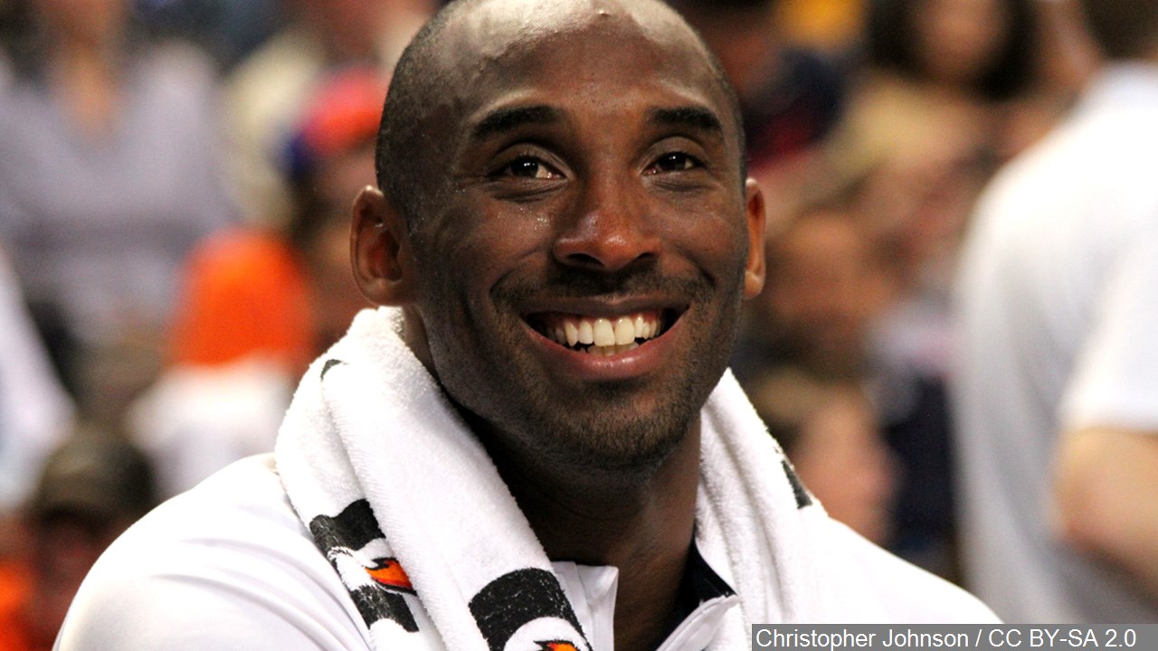 Los Angeles Lakers' Kobe Bryant, right, has a laugh with his