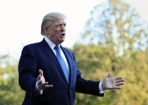 President Donald Trump speaks to reporters upon his return to the White House in Washington, Sunday, Sept. 24, 2017. (AP Photo/Manuel Balce Ceneta)