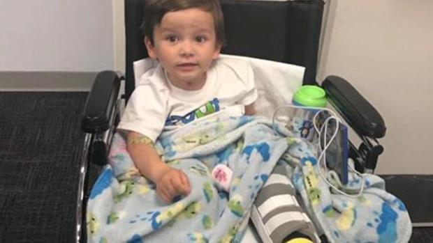 Hunter was hospitalized with AFM when he was 15 months old. Photo via CBS News.