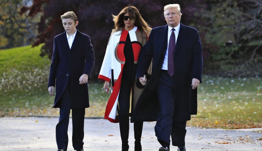 President Donald Trump with first lady Melania Trump and their son Barron Trump leave the White House Oval Office to travel to Mar-a-Lago in Florida. (AP photo)