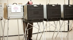 A man casting his ballot. Photo via CBS News.