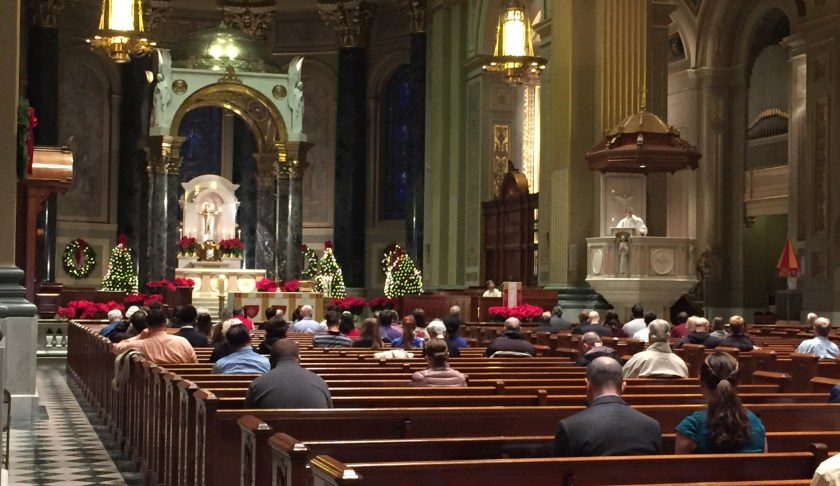Worshipers gather at Christmas Mass. Photo via CBS.