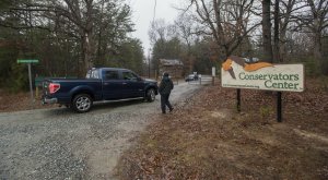 Conservators Center workers let a pickup truck enter property in Burlington, N.C., Monday, Dec. 31, 2018. An intern was cleaning an animal enclosure at the North Carolina wildlife center when a lion escaped from a nearby pen and attacked her, killing the young woman and sending visitors out of the zoo, authorities said. Photo via AP/Woody Marshall/The Times-News.