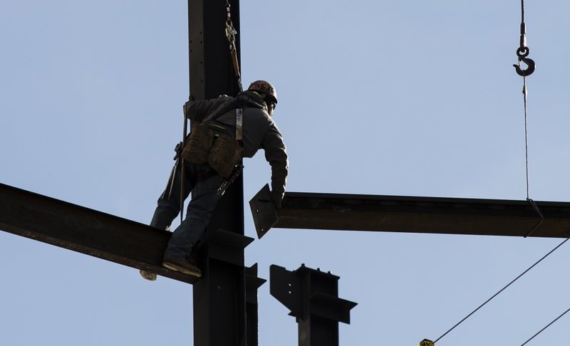 In this Nov. 29, 2018, file photo an Ironworker helps to construct a building in Philadelphia. Photo via AP.