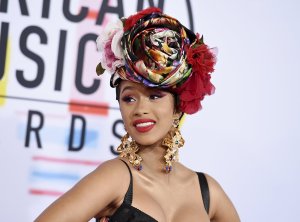 In this Oct. 9, 2018, file photo, Cardi B arrives at the American Music Awards, at the Microsoft Theater in Los Angeles. Cardi B, Pharrell, Kanye West were among the celebrities who fanned out across Miami for a week of glamorous parties toasting the world’s best artists during Art Basel. The prestigious extension of the annual contemporary art fair in Basel, Switzerland, officially opened Thursday, Dec. 6.(Photo by Jordan Strauss/Invision/AP, File)