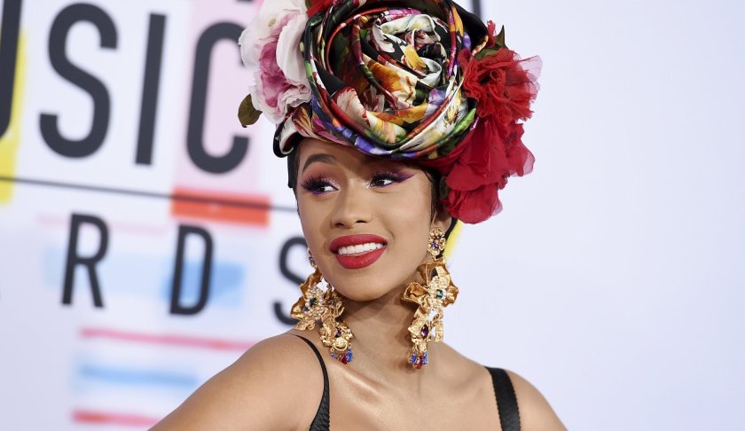 In this Oct. 9, 2018, file photo, Cardi B arrives at the American Music Awards, at the Microsoft Theater in Los Angeles. Cardi B, Pharrell, Kanye West were among the celebrities who fanned out across Miami for a week of glamorous parties toasting the world’s best artists during Art Basel. The prestigious extension of the annual contemporary art fair in Basel, Switzerland, officially opened Thursday, Dec. 6.(Photo by Jordan Strauss/Invision/AP, File)