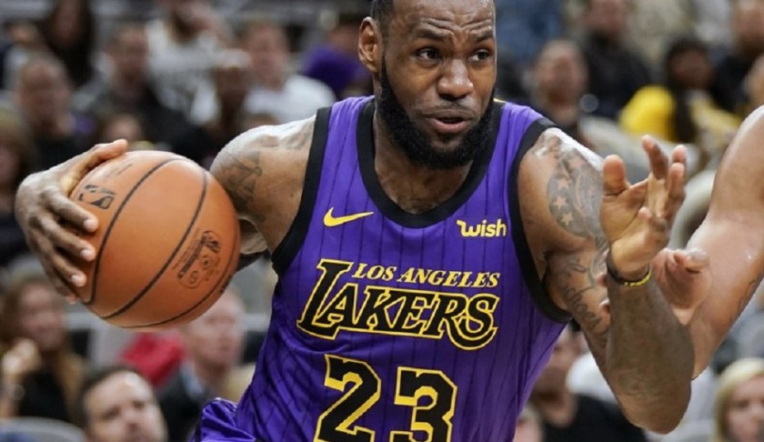 In this Dec. 7, 2018, file photo, Los Angeles Lakers' LeBron James (23) drives against the San Antonio Spurs during the first half of an NBA basketball game, in San Antonio. LeBron James was named The Associated Press Male Athlete of the Year on Thursday, Dec. 27, 2018. Photo via AP/Darren Abate.
