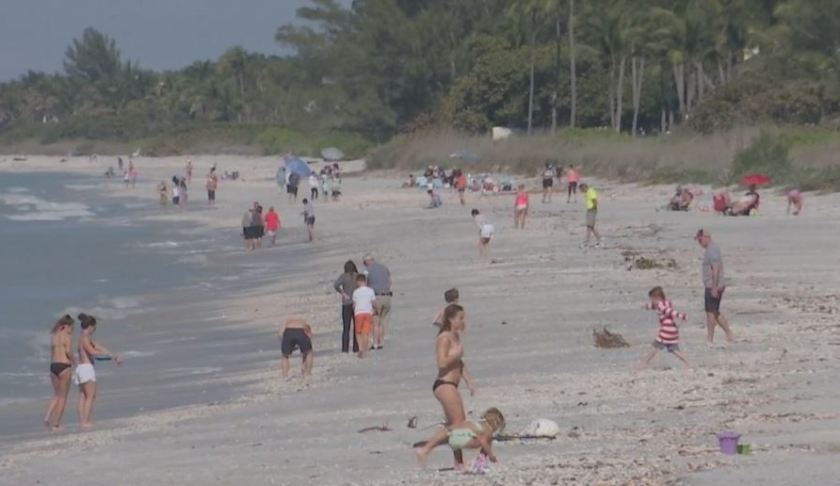 Many people out on the beach that will see revitalization soon. Photo via WINK News.
