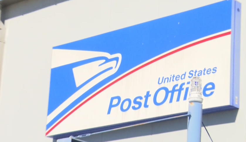 Outside of a United States Post Office mailing center. Photo via WINK News.