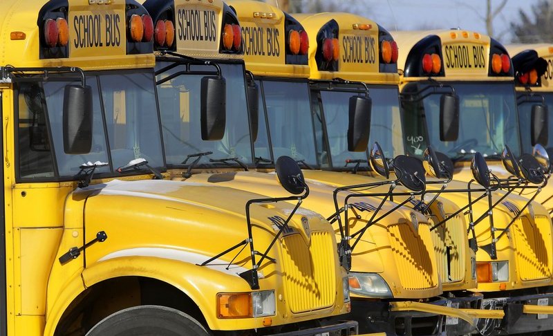 Parked school buses. Photo via AP/Seth Perlman.