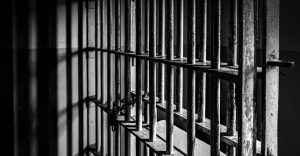 Prison cell bars. Photo via CBS.