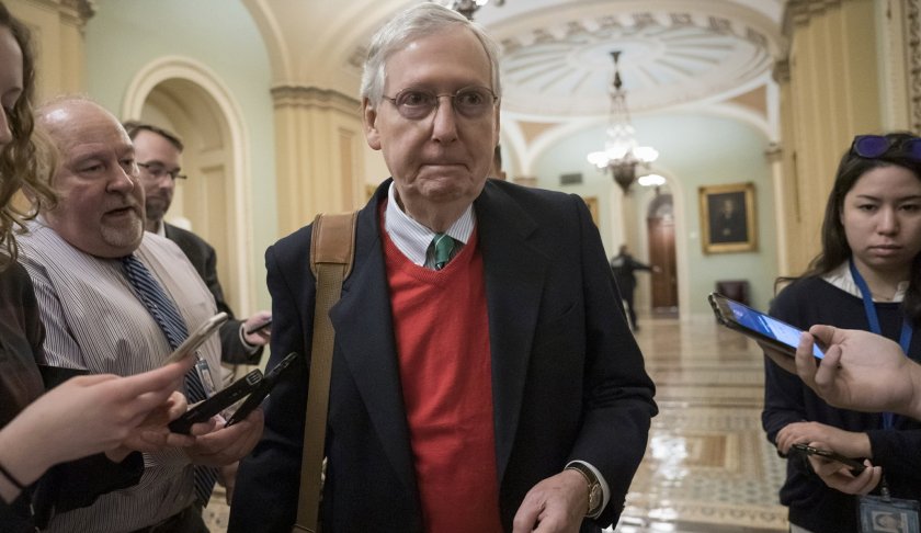 Senate Majority Leader Mitch McConnell, R-Ky., is met by reporters as he arrives at the Capitol on the first morning of a partial government shutdown in Washington, Saturday, Dec. 22, 2018. Photo via AP/Scott Applewhite.