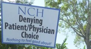 Sign claims the biggest medical groups in SWFL are denying patients the right to choose their own physician. Photo via WINK News.