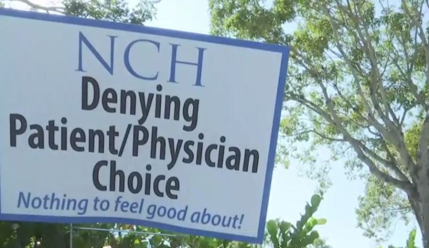 Sign claims the biggest medical groups in SWFL are denying patients the right to choose their own physician. Photo via WINK News.