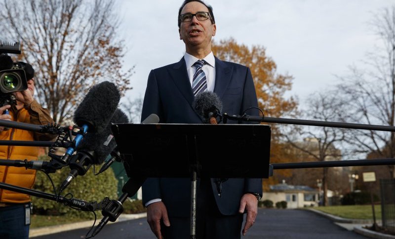 FILE - In this Dec. 3, 2018, file photo, Treasury Secretary Steve Mnuchin talks with reporters at the White House in Washington. Trump says he has confidence in Mnuchin, calling him a "very talented guy" and a "very smart person." Photo via AP/Evan Vucci.