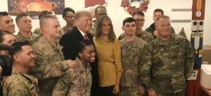 Trump visits troops in Iraq. Photo via CBS News.