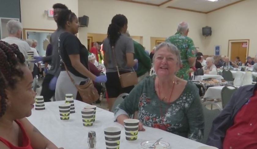 Two strangers meet one another at the Christmas dinner. Photo via WINK News.