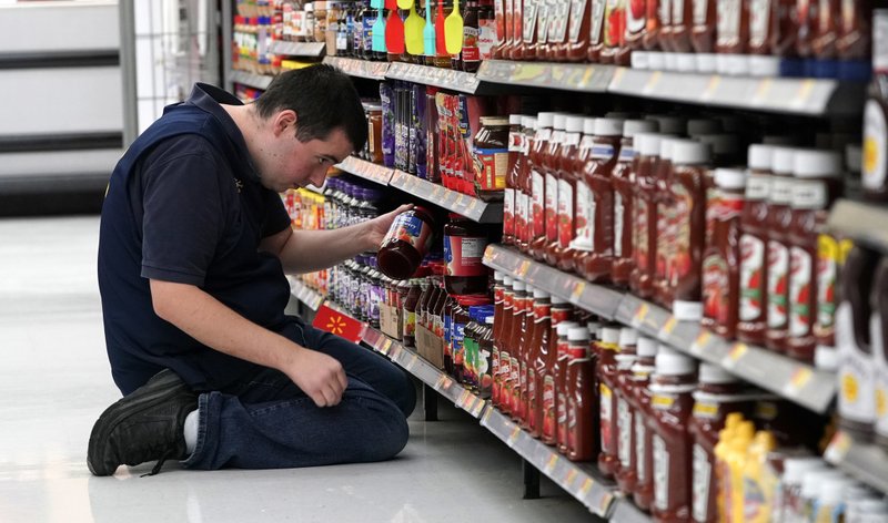 In this Nov. 9, 2018, file photo a Walmart associate stocks a shelf at a Walmart Supercenter in Houston. On Monday, Jan. 7, 2019, the Institute for Supply Management, a trade group of purchasing managers, issues its index of non-manufacturing activity for December. Photo via AP Photo/David J. Phillip.