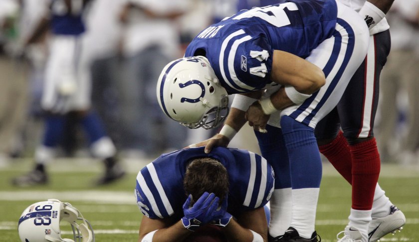 Tight end Ben Utecht #86 of the Indianapolis Colts nurses his head after being hit by free safety C.C. Brown of the Houston Texans as tight end Dallas Clark #44 checks on him in the first quarter September 17, 2006 at the RCA Dome in Indianapolis, Indiana. The Colts won, 43-24. Photo via CBS.