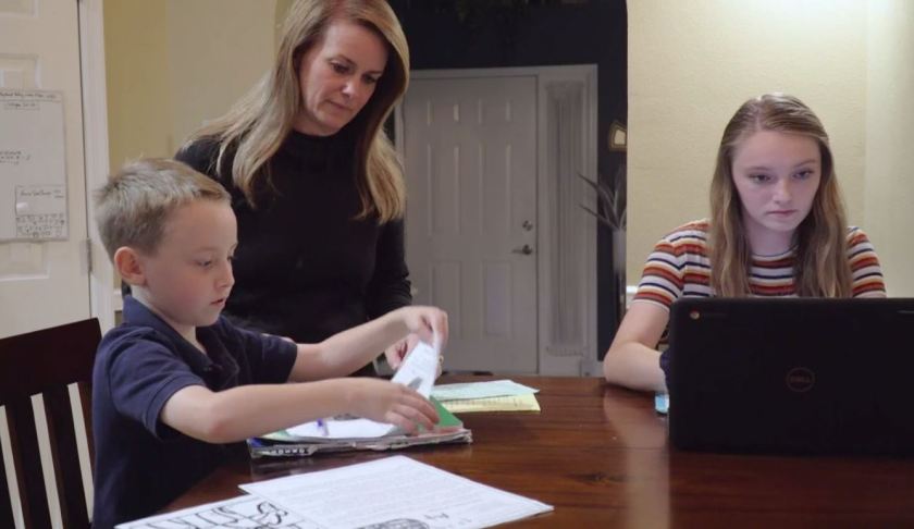 Mom checks in with her children as they are doing homework. (Ivanhoe Newswire photo)
