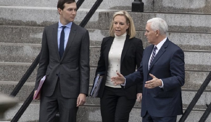 White House Senior Adviser Jared Kushner, left, Homeland Security Secretary Kirstjen Nielsen, and Vice President Mike Pence, talk as they walk down the steps of the Eisenhower Executive Office Building on the White House complex, Saturday, Jan. 5, 2019, in Washington. Photo via AP/Alex Brandon.