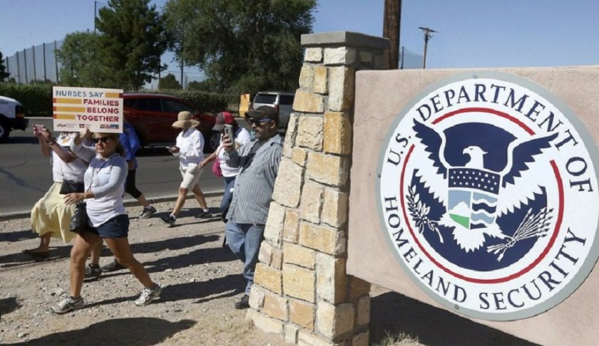 This June 2018 photo shows protesters walking along Montana Avenue outside the El Paso Processing Center, in El Paso, Texas. Federal immigration officials are force feeding some of the immigrants who have been on hunger strike for nearly a month inside the Texas detention facility, The Associated Press has learned. (Rudy Gutierrez/The El Paso Times via AP)