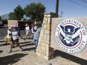 This June 2018 photo shows protesters walking along Montana Avenue outside the El Paso Processing Center, in El Paso, Texas. Federal immigration officials are force feeding some of the immigrants who have been on hunger strike for nearly a month inside the Texas detention facility, The Associated Press has learned. (Rudy Gutierrez/The El Paso Times via AP)