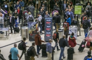 Security lines at Hartsfield-Jackson International Airport in Atlanta stretch more than an hour long amid the partial federal shutdown, causing some travelers to miss flights. Photo via AP.