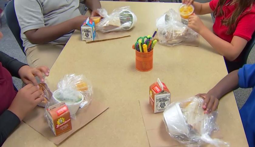 Students snacking on package meals. WINK News photo.