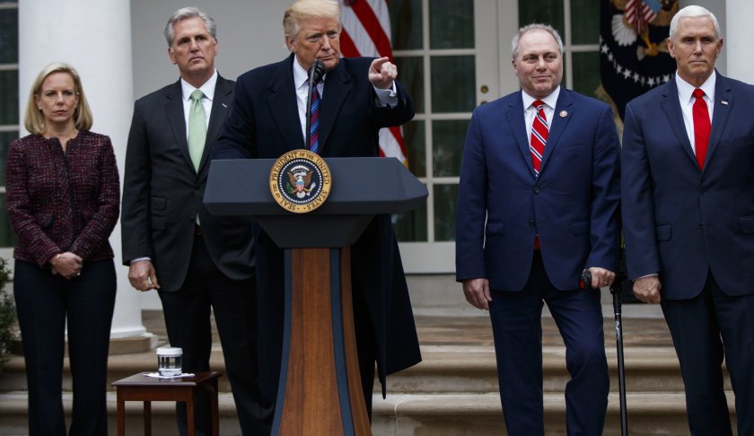 President Donald Trump speaks during a news conference in the Rose Garden of the White House after meeting with lawmakers about border security, Friday, Jan. 4, 2019, in Washington as Secretary of Homeland Security Kirstjen Nielsen, House Minority Leader Kevin McCarthy of Calif., House Minority Whip Steve Scalise of La., and Vice President Mike Pence, listen. Photo via AP/Manuel Balce Ceneta.