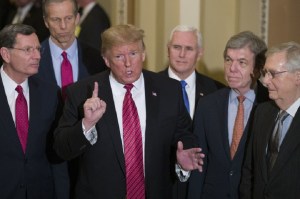 Sen. John Barrasso, R-Wyo., left, and Sen. John Thune, R-S.D., stand with President Donald Trump, Vice President Mike Pence, Sen. Roy Blunt, R-Mo., and Senate Majority Leader Mitch McConnell of Ky., as Trump speaks while departing after a Senate Republican Policy luncheon, on Capitol Hill in Washington, Wednesday, Jan. 9, 2019. Photo via AP/Alex Brandon.