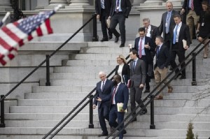 Vice President Mike Pence, left, White House legislative affairs aide Ja'Ron Smith, Homeland Security Secretary Kirstjen Nielsen, second row left, White House Senior Adviser Jared Kushner, and others, walk down the steps of the Eisenhower Executive Office building, on the White House complex, after a meeting with staff members of House and Senate leadership, Saturday, Jan. 5, 2019, in Washington. Photo via AP/Alex Brandon.