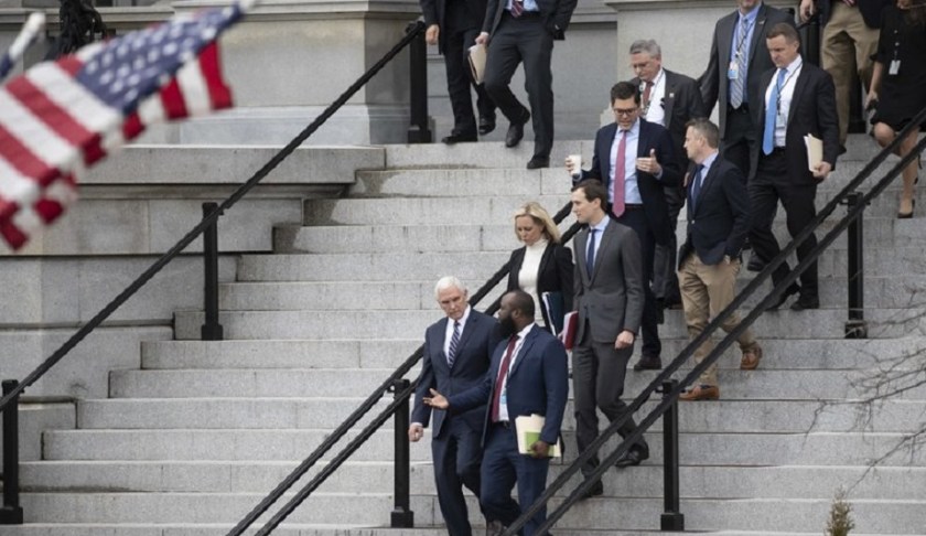 Vice President Mike Pence, left, White House legislative affairs aide Ja'Ron Smith, Homeland Security Secretary Kirstjen Nielsen, second row left, White House Senior Adviser Jared Kushner, and others, walk down the steps of the Eisenhower Executive Office building, on the White House complex, after a meeting with staff members of House and Senate leadership, Saturday, Jan. 5, 2019, in Washington. Photo via AP/Alex Brandon.