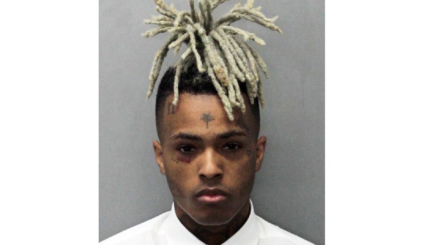 FILE - This undated photo released by the Miami-Dade Corrections & Rehabilitation Department shows rapper XXXTentacion. Seven months after XXXTentacion was murdered, the rapper-singer’s son has been born. Jenesis Sanchez, XXXTentacion’s girlfriend, on Saturday gave birth to baby boy Gekyume Onfroy. The birth was announced Saturday, Jan. 26, 2019, by XXXTentacion’s mother, Cleopatra Bernard. (Miami-Dade Corrections & Rehabilitation Department via AP, File)