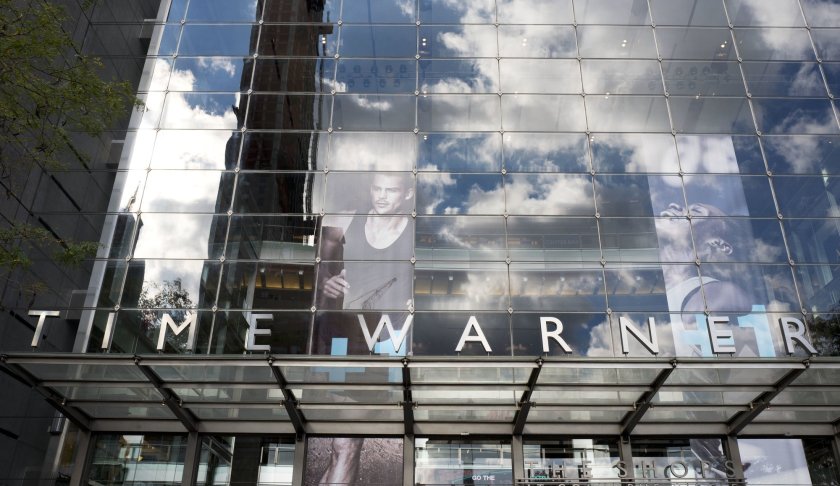 FILE - In this Oct. 24, 2016, file photo, clouds are reflected in the glass facade of the Time Warner building in New York. A federal appeals court on Tuesday, Feb. 26, 2019 upheld AT&T's $81 billion takeover of Time Warner, approving one of the biggest media deals on record in the face of opposition from the Trump administration. The combination of one of the country's largest wireless carriers and TV providers with a major TV and movie company has already reshaped the media landscape. (AP Photo/Mark Lennihan, File)