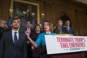 House Speaker Nancy Pelosi of Calif., accompanied by Rep. Joaquin Castro, D-Texas, left, and others, speaks about a resolution to block President Donald Trump's emergency border security declaration on Capitol Hill, Monday, Feb. 25, 2019 in Washington. House Democrats have introduced a resolution to block the national emergency declaration that President Donald Trump issued last week to fund his long-sought wall along the U.S-Mexico border, setting up a fight that could result in Trump's first-ever veto. (AP Photo/Alex Brandon)