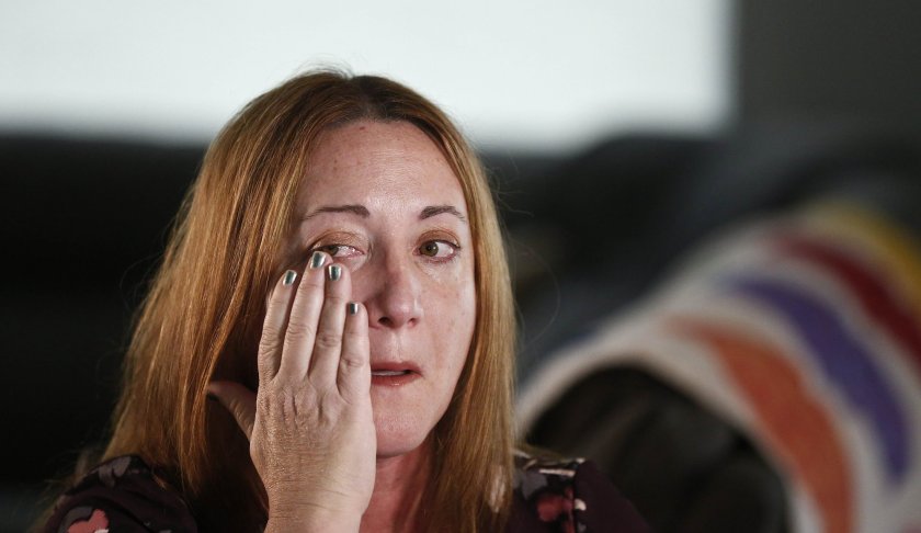 Lori Alhadeff, mother of 14-year-old Alyssa Alhadeff who was one of 17 people killed at Marjory Stoneman Douglas High School, wipes away a tear as she cries while talking about her daughter on Wednesday, Jan. 30, 2019, in Parkland, Fla. She and her husband marched with Parkland students in Washington, demanding gun control. And in May, she was elected to the school board. (AP Photo/Brynn Anderson)