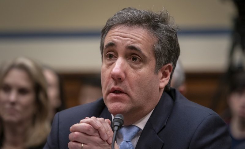 FILE - In this Wednesday, Feb. 27, 2019, file photo, Michael Cohen, President Donald Trump's former personal lawyer, reacts as he finishes a day of testimony to the House Oversight and Reform Committee, on Capitol Hill in Washington. While Cohen’s testimony Wednesday is an unusual case, psychologists say people tend to believe informants because we have a “truth bias.” Psychologists say we don’t like to think people lie and we like remorse. Research shows that jurors sometimes even disregard their own biases when presented with the testimony of an informant. (AP Photo/J. Scott Applewhite)