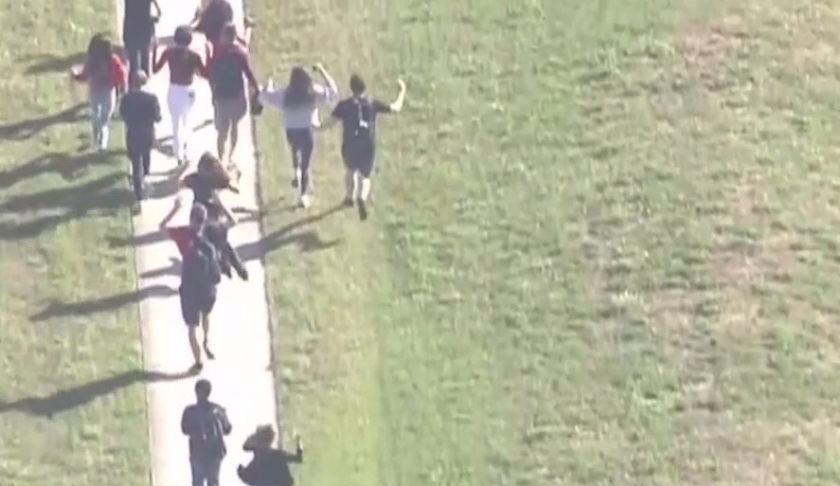 Parkland students flee the school as a mass shooting takes place. (WINK News photo)