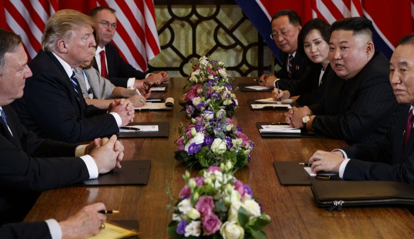 President Donald Trump speaks during a meeting with North Korean leader Kim Jong Un Thursday, Feb. 28, 2019, in Hanoi. At front right is Kim Yong Chol, a North Korean senior ruling party official and former intelligence chief. At left is Secretary of State Mike Pompeo, second from left. (AP Photo/ Evan Vucci)