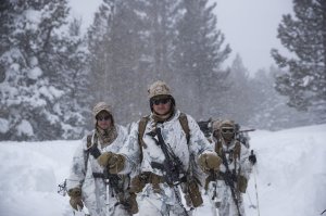 U.S. Marines walk along a snow-covered trail during their advanced cold-weather training at the Marine Corps Mountain Warfare Training Center Sunday, Feb. 10, 2019, in Bridgeport, Calif. After 17 years of war against Taliban and al-Qaida-linked insurgents, the military is shifting its focus to better prepare for great-power competition with Russia and China, and against unpredictable foes such as North Korea and Iran. (AP Photo/Jae C. Hong)