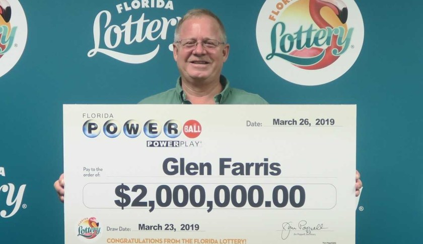 Glen Farris poses with his oversized check after claiming a $2 million prize in the POWERBALL drawing held on March 23, 2019 at Florida Lottery Headquarters. (Credit: Florida Lottery).
