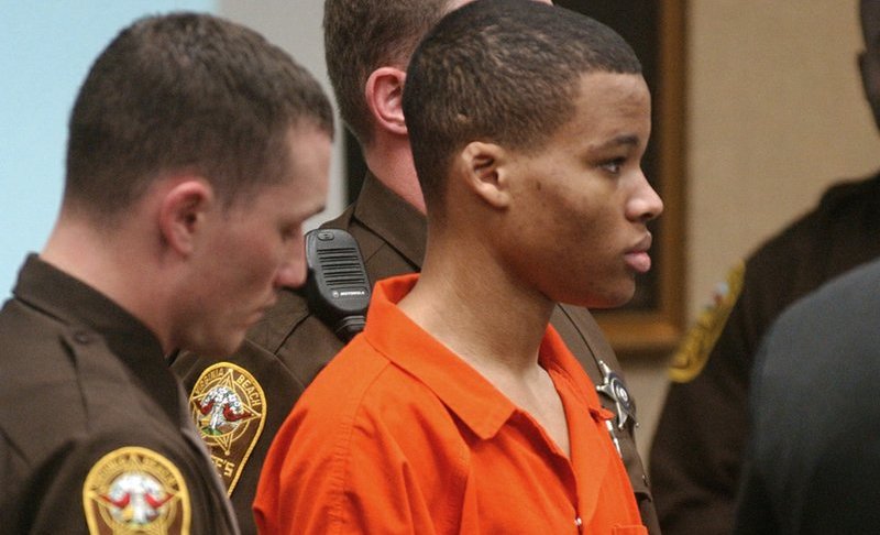 FILE - In this Oct. 20, 2003 file photo, Lee Boyd Malvo listens to court proceedings during the trial of fellow sniper suspect John Allen Muhammad in Virginia Beach, Va. The Supreme Court has agreed to consider Virginia’s plea to reinstate the life without parole sentence of a man who participated in sniper shootings that terrorized the Washington, D.C., region in 2002. The justices said Monday they will take up the state’s appeal in the case of Lee Boyd Malvo. Malvo was 17 when he and John Allen Muhammad fatally shot 10 people in Maryland, Virginia and Washington. Malvo was sentenced to life-without-parole terms in both Virginia and in Maryland. (AP Photo/Martin Smith-Rodden, Pool, File)
