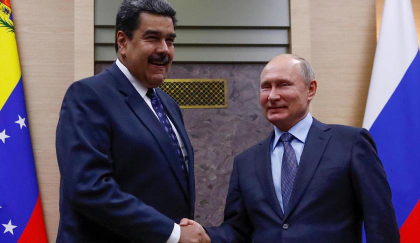 Nicolas Maduro shakes the hand of Vladimir Putin. (Credit: CBS News)