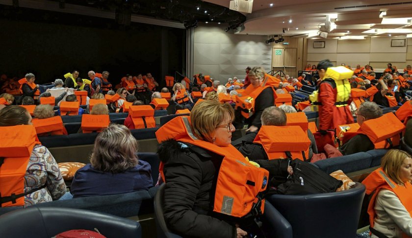 This photo provided by Michal Stewart shows passengers on board the Viking Sky, waiting to be evacuated, off the coast of Norway on Saturday, March 23, 2019. Rescue workers off Norway's western coast rushed to evacuate 1,300 passengers and crew from the disabled cruise ship by helicopter on Saturday, winching them one-by-one to safety as heaving waves tossed the ship from side to side and high winds battered the operation. (Michal Stewart via AP)