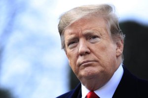 FILE - In this Wednesday, March 20, 2019 file photo, President Donald Trump speaks to reporters before leaving the White House in Washington, for a trip to visit a Army tank plant in Lima, Ohio, and a fundraising event in Canton, Ohio. Trump on Wednesday, March 27, 2019, will present his eighth Medal of Honor at the White House, to the family of Army Staff Sgt. Travis Atkins, who gave his life in 2007 to save fellow soldiers from an Iraqi suicide bomber. (AP Photo/Manuel Balce Ceneta, File)