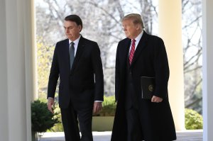 President Donald Trump walks with visiting Brazilian President Jair Bolsonaro along the Colonnade of the White House, Tuesday, March 19, 2019, in Washington. (AP Photo/Manuel Balce Ceneta)