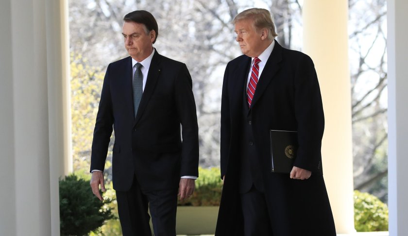 President Donald Trump walks with visiting Brazilian President Jair Bolsonaro along the Colonnade of the White House, Tuesday, March 19, 2019, in Washington. (AP Photo/Manuel Balce Ceneta)