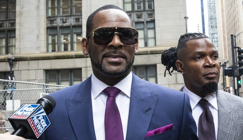 R. Kelly walks out of The Daley Center after an appearance in court for his child support case, Wednesday, March 13, 2019, in Chicago. (Ashlee Rezin/Chicago Sun-Times via AP)