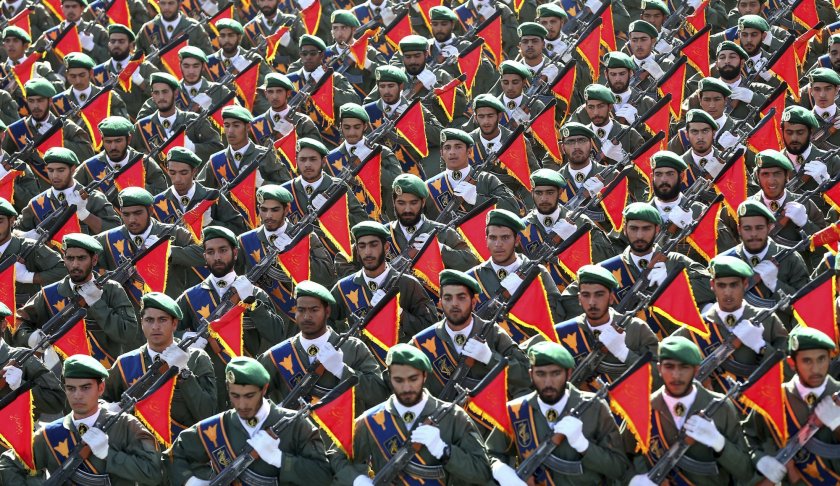 FILE - In this Sept. 21, 2016 file photo, Iran's Revolutionary Guard troops march in a military parade marking the 36th anniversary of Iraq's 1980 invasion of Iran, in front of the shrine of late revolutionary founder Ayatollah Khomeini, just outside Tehran, Iran. The Trump administration is preparing to designate Iran’s Revolutionary Guards Corps a “foreign terrorist organization” in an unprecedented move that could have widespread implications for U.S. personnel and policy. U.S. Officials say an announcement could come as early as Monday, April 8, 2019, following a months-long escalation in the administration’s rhetoric against Iran. The move would be the first such designation by any U.S. administration of an entire foreign government entity. (AP Photo/Ebrahim Noroozi, File)